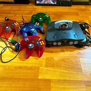 Nintendo 64 w/ 4 controllers and Golden eye 007 game.